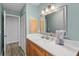Bathroom features an updated vanity, spacious countertop, and modern fixtures at 234 85Th St, Holmes Beach, FL 34217