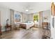 Cozy bedroom features wood floors, a ceiling fan, and natural light with windows at 234 85Th St, Holmes Beach, FL 34217