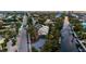 Charming two-story home with a canal view, surrounded by lush trees, with ample parking space at 234 85Th St, Holmes Beach, FL 34217