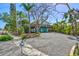 Charming home with a spacious driveway and lush landscaping, adding to the property's appeal at 234 85Th St, Holmes Beach, FL 34217