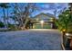 Charming two-story home featuring a spacious driveway and two-car garage at 234 85Th St, Holmes Beach, FL 34217