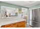 Modern kitchen has stainless steel appliances and granite countertops in an open-concept living space at 234 85Th St, Holmes Beach, FL 34217