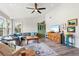 Comfortable living room with a large sofa, decorative accents, and hardwood flooring at 234 85Th St, Holmes Beach, FL 34217