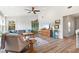 Cozy living room with wood floors and furniture, complimented by decorations throughout the living area at 234 85Th St, Holmes Beach, FL 34217