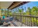 Relaxing screened-in porch with comfortable seating and a view of lush greenery at 234 85Th St, Holmes Beach, FL 34217