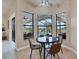 Cozy breakfast nook with a view of the pool and outdoor dining area at 24017 Peppercorn Rd, Punta Gorda, FL 33955