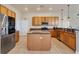 A gourmet kitchen featuring an island, stainless steel appliances, and ample cabinet space at 24017 Peppercorn Rd, Punta Gorda, FL 33955