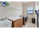 Functional laundry room with modern appliances, a sink, and ample counter space for folding and organizing at 24017 Peppercorn Rd, Punta Gorda, FL 33955