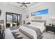 Bright main bedroom featuring modern design, private balcony access and a view of the pool at 24017 Peppercorn Rd, Punta Gorda, FL 33955