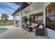Inviting covered patio featuring comfortable seating and a pool view, perfect for outdoor gatherings and relaxation at 24017 Peppercorn Rd, Punta Gorda, FL 33955