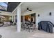 Inviting covered patio featuring comfortable seating and a dining area for outdoor gatherings and relaxation at 24017 Peppercorn Rd, Punta Gorda, FL 33955