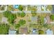 Wide aerial view of the property and surrounding neighborhood, showing ample lot size outlined in white at 275 Burke Rd, Venice, FL 34293