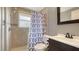 Neutral bathroom featuring updated shower head, single sink vanity, and new fixtures at 275 Burke Rd, Venice, FL 34293