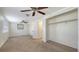 Spacious bedroom features carpet, dual ceiling fans, and closet space at 275 Burke Rd, Venice, FL 34293