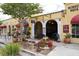 Charming cafe and retail area, enhanced by colorful awnings, lush planters, and attractive outdoor seating at 275 Burke Rd, Venice, FL 34293