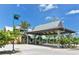 Inviting covered entrance with well-manicured landscaping leading to a coastal property at 275 Burke Rd, Venice, FL 34293