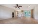 Bright, open kitchen with white appliances, an island, and seamless flow to the adjacent living spaces at 275 Burke Rd, Venice, FL 34293