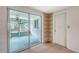 Access to lanai showcasing tiled flooring, a ceiling fan, and easy access to the kitchen at 275 Burke Rd, Venice, FL 34293