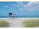 Scenic view of a lifeguard tower on a pristine sandy beach with calm ocean waters at 275 Burke Rd, Venice, FL 34293