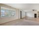 Bright living room with ample natural light, tile flooring, and a neutral color palette offers a versatile living space at 275 Burke Rd, Venice, FL 34293