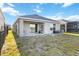 Spacious backyard with a covered patio, ideal for outdoor entertaining at 2812 Rock Sound St, Bradenton, FL 34208