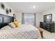 Bedroom with a view of the lake, features stylish floral wall art and elegant dark wood furnishings at 2812 Rock Sound St, Bradenton, FL 34208