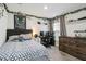 Well-decorated bedroom with a comfortable bed, desk area, ample storage, and themed decorations at 2812 Rock Sound St, Bradenton, FL 34208
