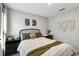 Cozy bedroom featuring a comfortable bed, stylish decor, and functional side table and desk at 2812 Rock Sound St, Bradenton, FL 34208