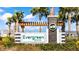 Community entrance sign for Evergreen Estates, featuring stone accents, manicured shrubs, and decorative elements at 2812 Rock Sound St, Bradenton, FL 34208