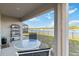 Covered patio with comfortable outdoor seating overlooking a tranquil lake at 2812 Rock Sound St, Bradenton, FL 34208