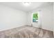 Comfortable bedroom with neutral carpet and natural light coming from the window at 2840 S Shade Ave, Sarasota, FL 34239