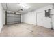 Spacious two-car garage featuring an automatic door and painted walls at 2840 S Shade Ave, Sarasota, FL 34239