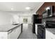 Modern kitchen featuring stainless steel appliances, granite countertops, sleek cabinetry and an open layout at 2840 S Shade Ave, Sarasota, FL 34239