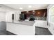 Modern kitchen featuring stainless steel appliances, granite countertops, sleek cabinetry, and an open layout at 2840 S Shade Ave, Sarasota, FL 34239