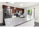 Close-up of a modern kitchen with stainless steel appliances, granite countertops, and sleek cabinetry at 2840 S Shade Ave, Sarasota, FL 34239