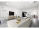 Bright and airy living room featuring contemporary furnishings and seamless transition to kitchen at 2840 S Shade Ave, Sarasota, FL 34239