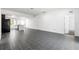 Open concept living space with tile floors and views of the kitchen, featuring a breakfast bar at 2840 S Shade Ave, Sarasota, FL 34239