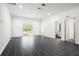 Spacious living room featuring tile floors, recessed lighting, and a sliding glass door to the outside at 2840 S Shade Ave, Sarasota, FL 34239