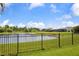 Spacious backyard with pond view and black metal fence at 2918 130Th E Ave, Parrish, FL 34219