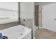Luxurious bathroom with a soaking tub and glass-enclosed shower at 2918 130Th E Ave, Parrish, FL 34219