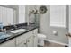 Well-lit bathroom with granite countertop, ample storage, and neutral tones, providing a functional and comfortable space at 2918 130Th E Ave, Parrish, FL 34219