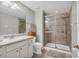 Bathroom with glass enclosed shower, white vanity and tiled floor at 2918 130Th E Ave, Parrish, FL 34219
