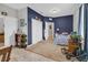 This bedroom features a walk-in closet, plush carpeting, and calming blue accent walls, creating a restful space at 2918 130Th E Ave, Parrish, FL 34219