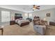 Primary bedroom showcasing a large bed, seating area, and plenty of natural light at 2918 130Th E Ave, Parrish, FL 34219