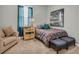 Cozy bedroom features a comfortable bed, stylish decor, and a bright window at 2918 130Th E Ave, Parrish, FL 34219