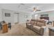 Bedroom featuring a cozy seating area, ceiling fan and neutral colored carpet at 2918 130Th E Ave, Parrish, FL 34219