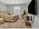 Bedroom showcasing a large window, queen size bed, and warm neutral carpeting at 2918 130Th E Ave, Parrish, FL 34219