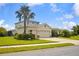 Two-story home with a three-car garage and manicured lawn, blending elegance and functionality at 2918 130Th E Ave, Parrish, FL 34219