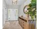 Inviting foyer with tile flooring, decorative mirror, and stylish console table, setting a welcoming tone at 2918 130Th E Ave, Parrish, FL 34219