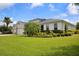 Lovely one-story home with a 3-car garage, attractive landscaping, manicured lawn, and freshly painted exterior at 2918 130Th E Ave, Parrish, FL 34219
